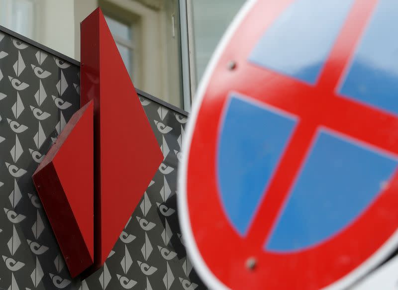 The logo of BAWAG PSK bank is seen behind a traffic sign at a branch office in Vienna