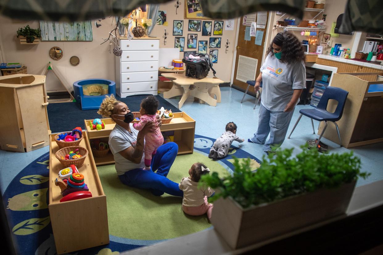 Caregivers interact with infants at the Trinity House Christian Childcare campus on Greenwood Avenue. March 28, 2022