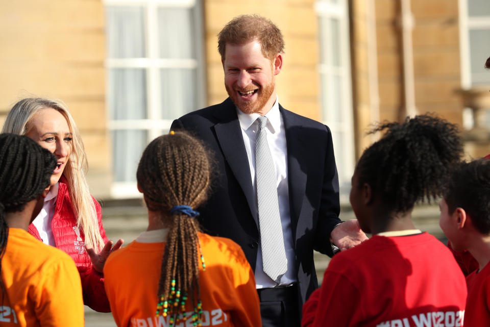 The Duke of Sussex visits with children playing rugby in the Buckingham Palace gardens, as he hosts the Rugby League World Cup 2021 draws on Jan. 16, 2020. (Photo: Yui Mok - PA Images via Getty Images)