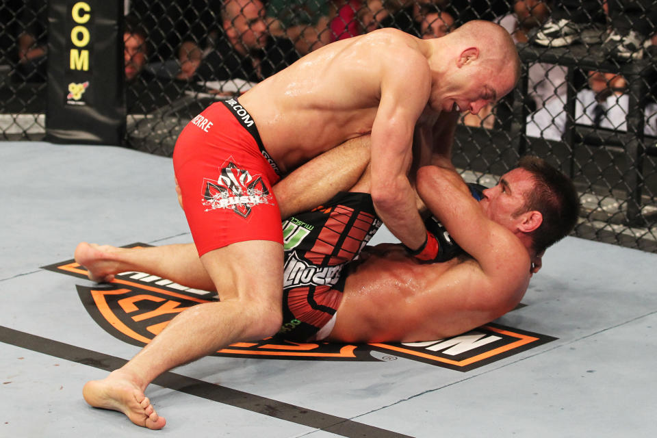 TORONTO, ON - APRIL 30: Georges St-Pierre (top) grapples with Jake Shields during their Welterweight Championship bout at UFC 129 in the Rogers Centre on April 30, 2011 in Toronto, Ontario. (Photo by Al Bello/Zuffa LLC/Zuffa LLC via Getty Images)