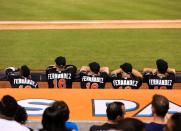 <p>Miami Marlins players look on from the dugout wearing Jose Fernandez jerseys in honor of the late pitcher during the game against the New York Mets at Marlins Park on September 26, 2016 in Miami, Florida. (Photo by Rob Foldy/Getty Images) </p>