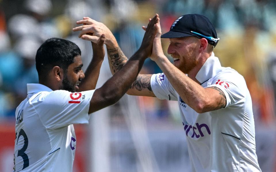 England's Rehan Ahmed celebrates with his captain Ben Stokes