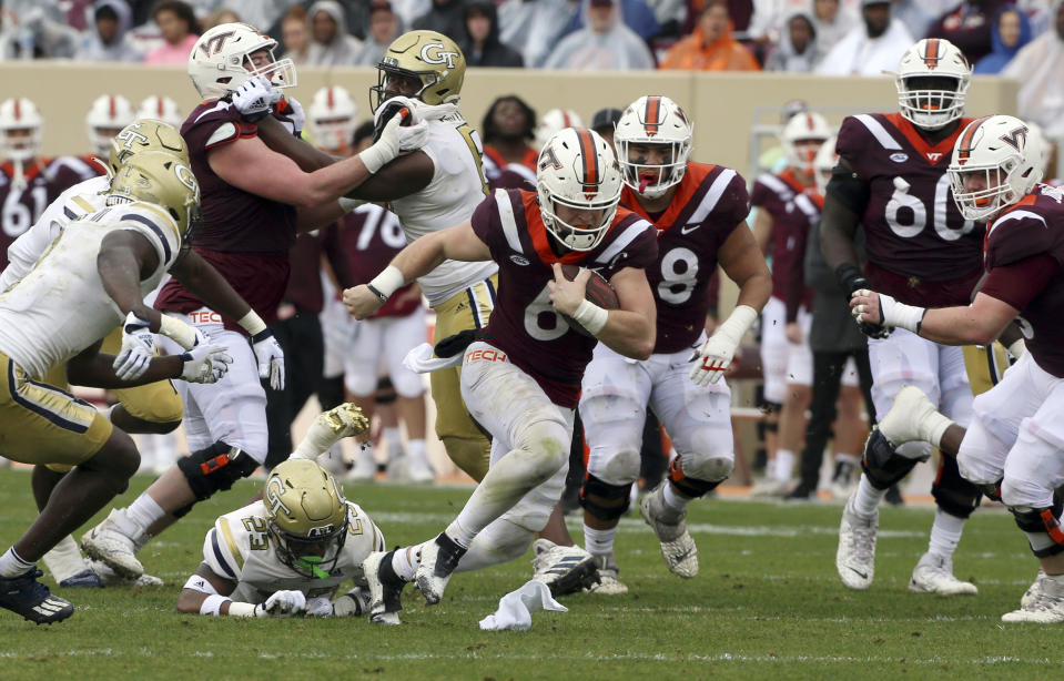 Virginia Tech's Virginia Tech's quarterback Grant Wells (6) runs for a first down in the first half during an NCAA college football game against Georgia Tech, Saturday, Nov. 5 2022, in Blacksburg, Va. (Matt Gentry/The Roanoke Times via AP)