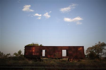 An abandoned train wagon is pictured on the tracks of the Goias Railroad, a little used train line built more than 100 years ago to link cities in southwestern Brazil, in Calambau, Goias State, September 26, 2013. REUTERS/Ueslei Marcelino