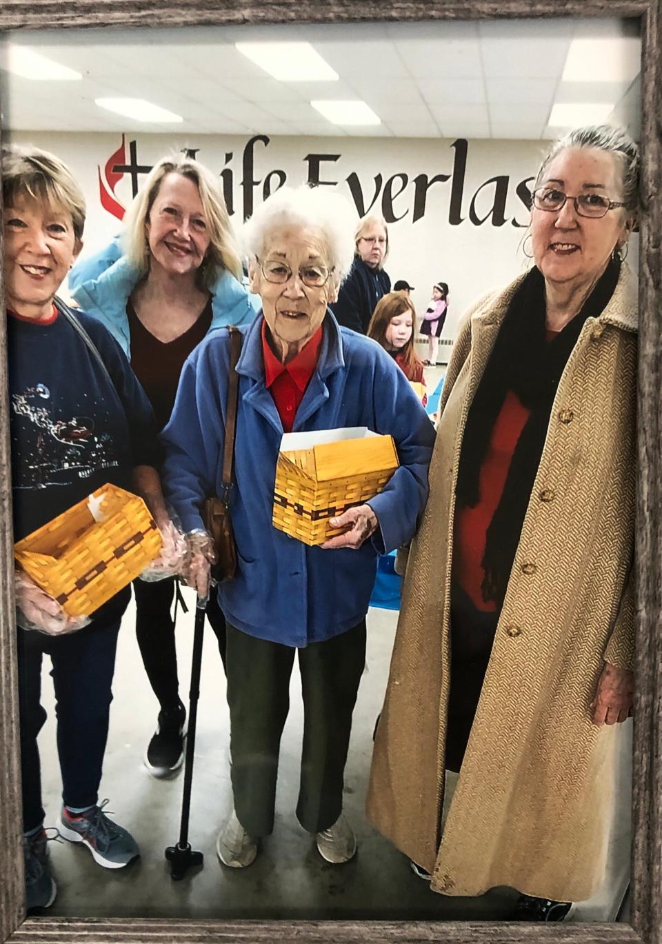 Elinor Gard, second from right, poses with daughters Cyndi Currier, left, Mary Gard and Melissa Gard at the Lydick United Methodist Church cookie walk in 2022. Elinor started the cookie walk more than 20 years ago, and after her death in October 2023, other volunteers have stepped up to continue the tradition.