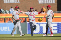 St. Louis Cardinals outfielders Alec Burleson, left, Michael Siani (63), and Lars Nootbaar celebrate the win by the Cardinals over the Detroit Tigers in the ninth inning in the first game of a baseball doubleheader, Tuesday, April 30, 2024, in Detroit. (AP Photo/Carlos Osorio)