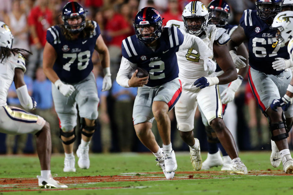 Sep 16, 2023; Oxford, Mississippi, USA; Mississippi Rebels quarterback Jaxson Dart (2) runs the ball for a first down during the first half against the Georgia Tech Yellow Jackets at Vaught-Hemingway Stadium. Mandatory Credit: Petre Thomas-USA TODAY Sports