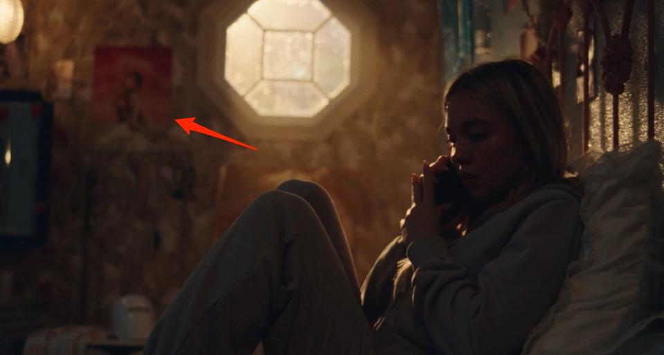 A red arrow pointing to a poster for Kehlani's album "SweetSexySavage" in Cassie's bedroom on "Euphoria."
