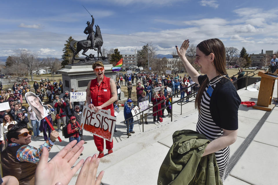 Rep. Zoey Zephyr, D-Missoula, waves to supporters during a rally on the steps of the Montana State Capitol, in Helena, Mont., Monday, April 24, 2023. Republican legislative leaders in Montana persisted in forbidding the Democratic transgender lawmaker from participating in debate for a second week as her supporters brought the House session to a halt Monday, chanting "Let her speak!" from the gallery before they were escorted out. (Thom Bridge/Independent Record via AP)