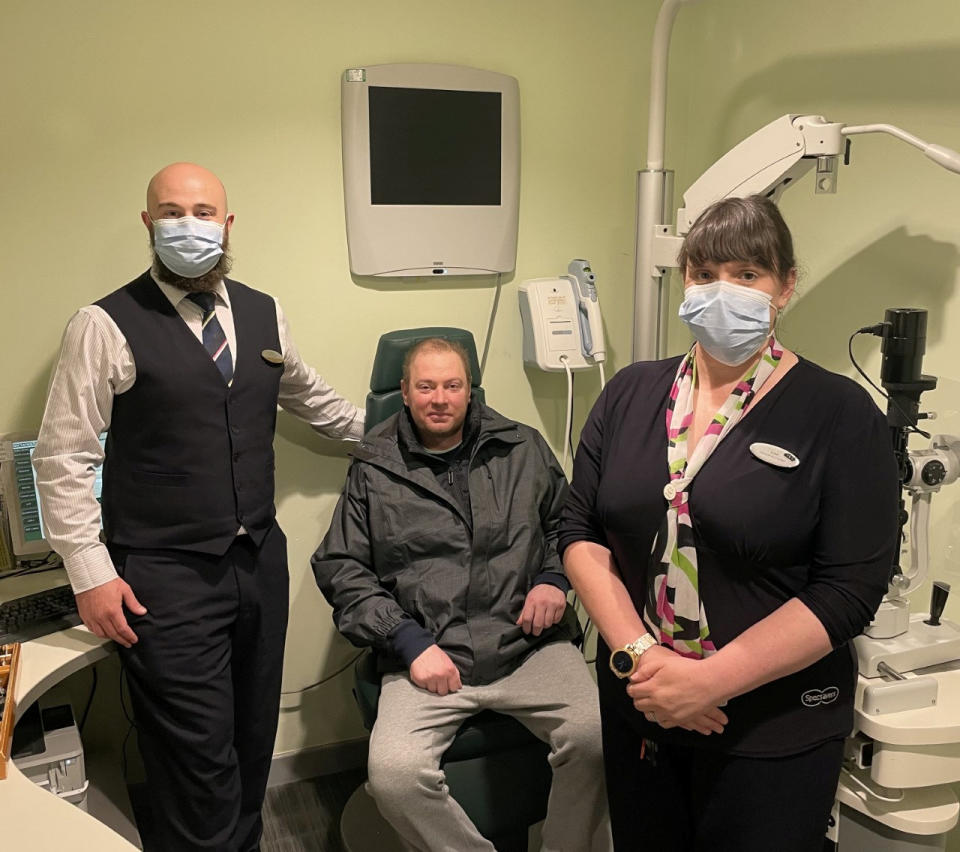 Voice suffered dizzy spells and headaches for seven years before being diagnosed with a brain tumour, pictured with Specsavers staff. (Matthew Voice/SWNS)