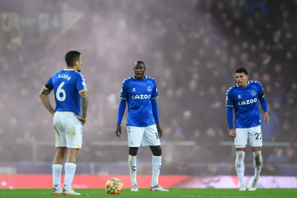 Everton’s Abdoulaye Doucoure and Ben Godfrey exchange words with Allan after Liverpool’s fourth goal (Getty)