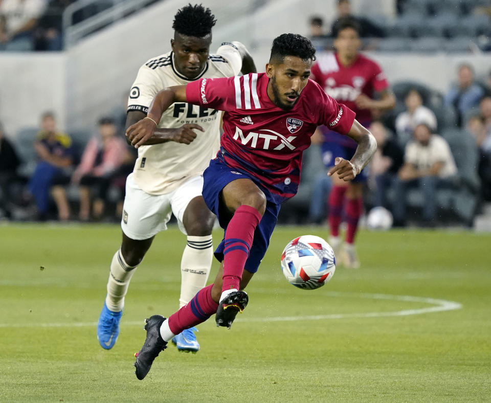 FILE - FC Dallas forward Jesús Ferreira, front, controls the ball against Los Angeles FC during the first half of an MLS soccer match June 23, 2021, in Los Angeles. Ferreira was the team's top scorer last year with 12 goals and six assists in league play. (AP Photo/Marcio Jose Sanchez, File)
