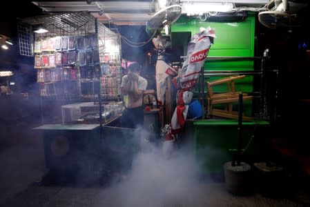 A man reacts after the police fired tear gas to disperse anti-extradition bill protesters demonstration at Sham Shui Po, in Hong Kong