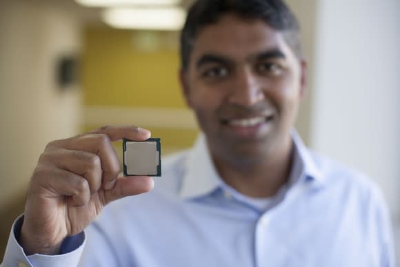 An Intel executive holding a processor.