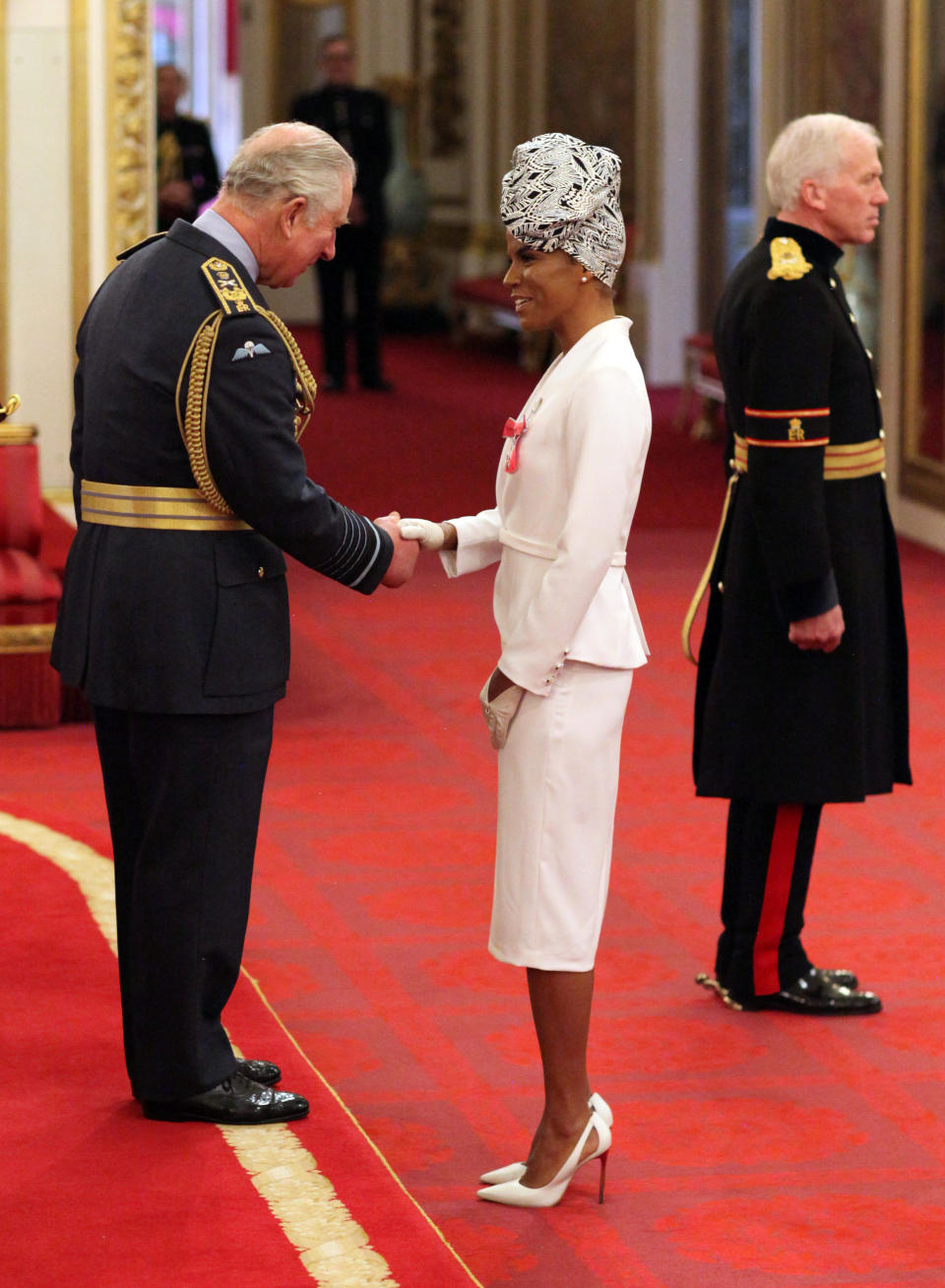 Niomi McLean-Daley (also known as Ms Dynamite), right, is made an MBE by the Prince of Wales (left) at Buckingham Palace (Jonathan Brady/PA)