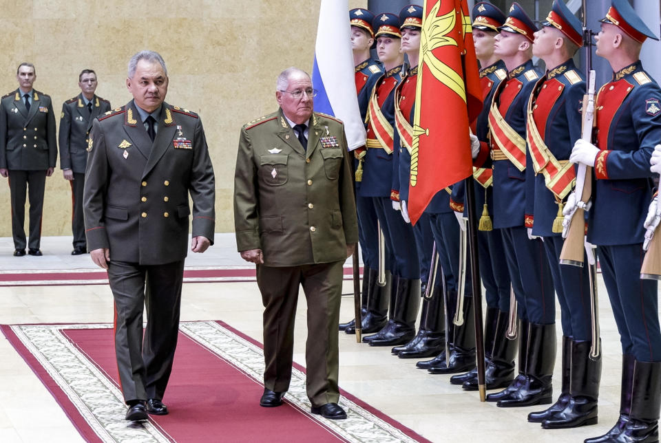 In this handout photo released by the Russian Defense Ministry Press Service, Russian Defense Minister Sergei Shoigu, left, and Cuban Defense Minister Alvaro Lopez Miera attend a welcome ceremony prior to their talks in Moscow, Russia, June 27, 2023. / Credit: Russian Defense Ministry Press Service via AP