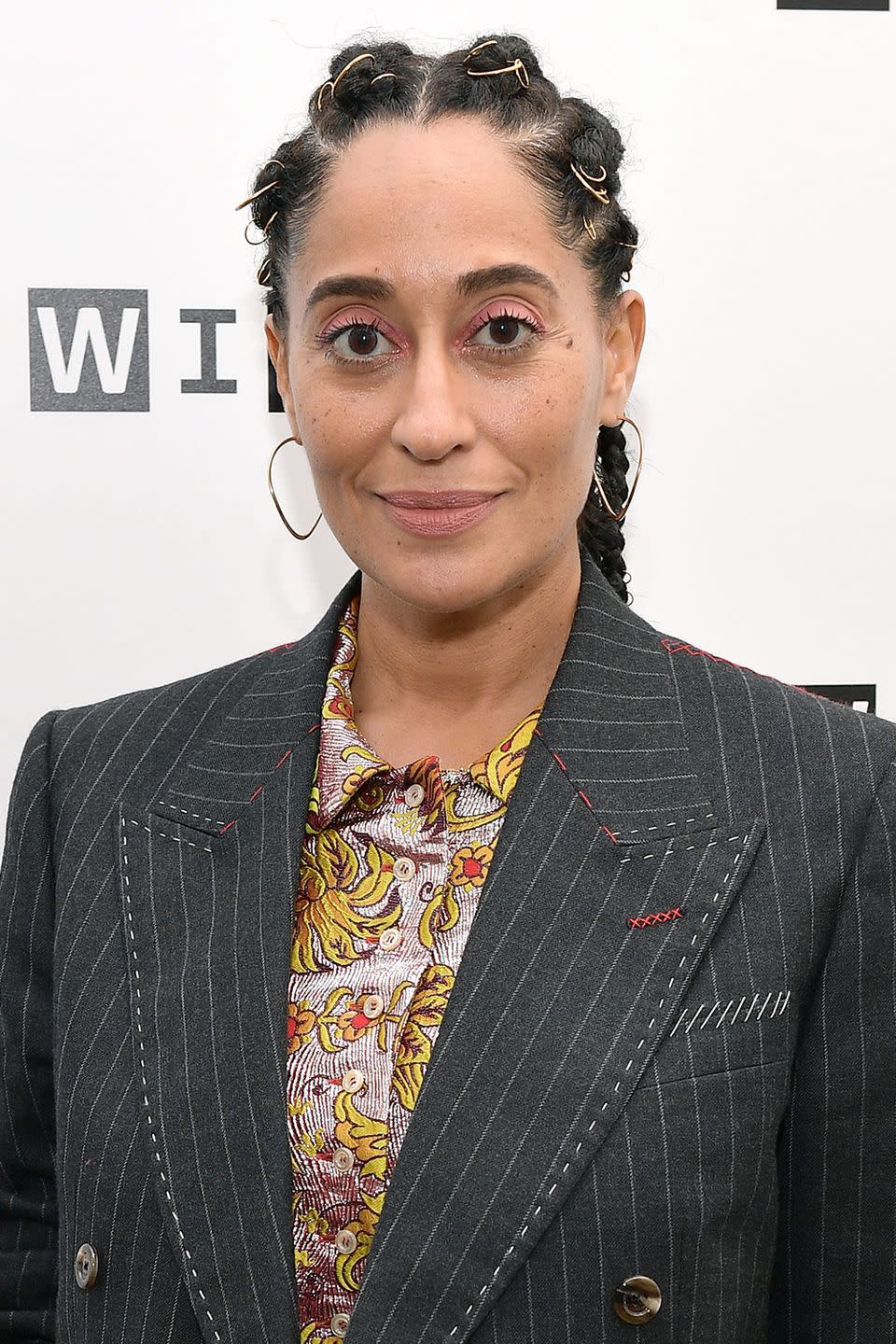 <p>Like jewelry for your hair, don't be afraid to add golden string to your braids like seen here on Tracee Ellis Ross. </p>