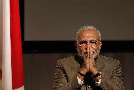 India's Prime Minister Narendra Modi gestures after giving a speech at his lecture meeting hosted by Nikkei Inc. and Japan External Trade Organization (JETRO) in Tokyo September 2, 2014. REUTERS/Toru Hanai/Files