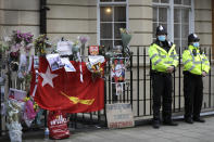 Police officers stand outside the Myanmar Embassy in London, Thursday, April 8, 2021. Newspaper reports say the embassy was taken over by members of the country's new military regime Wednesday evening. (AP Photo/Kirsty Wigglesworth)