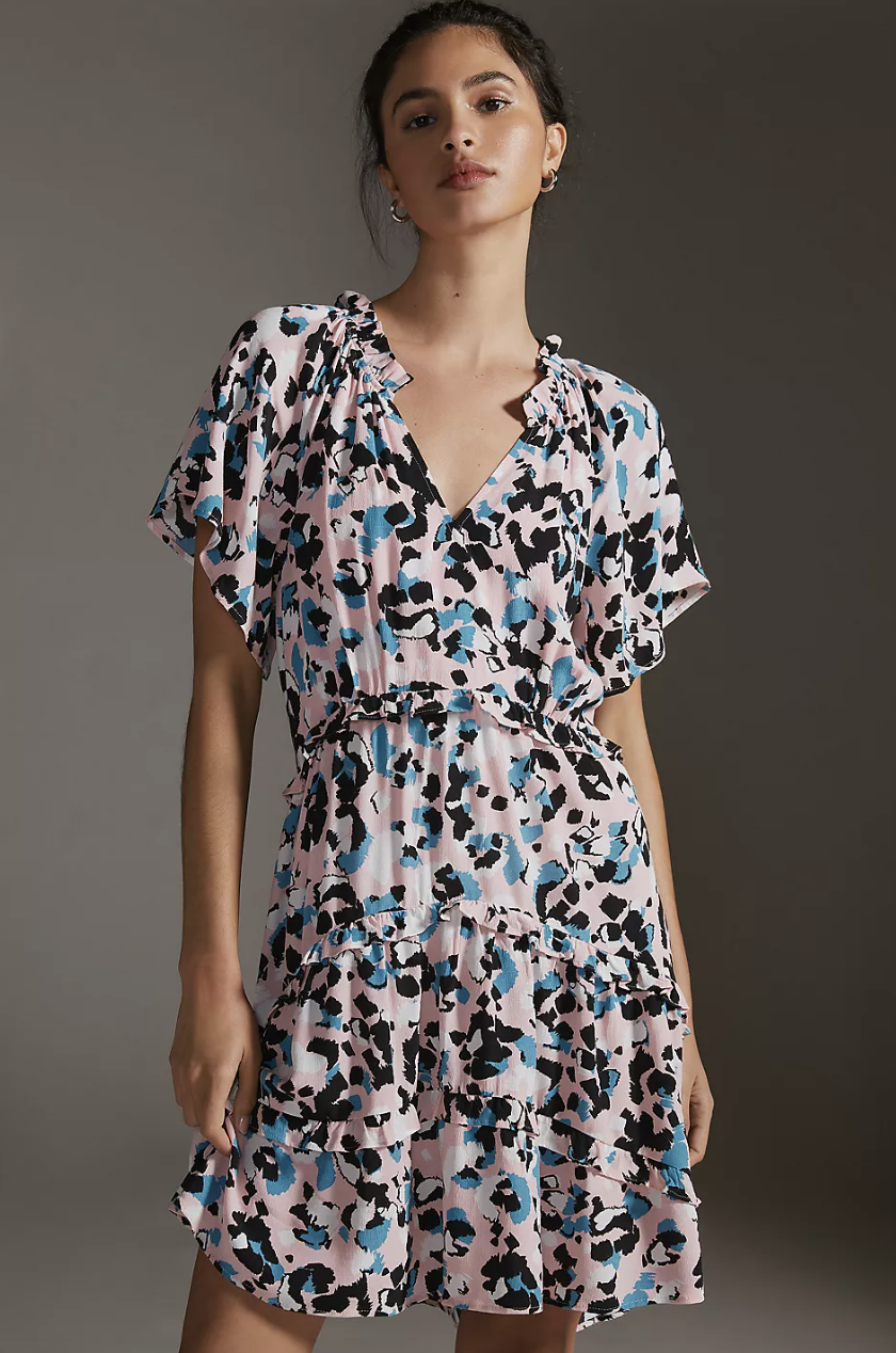 model in pink, black and blue printed Robin Tiered Mini Dress (Photo via Anthropologie)