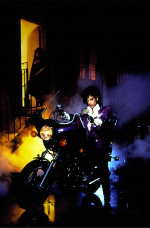 Purple Rain’s soundtrack proved to be just as iconic as the film itself, winning Prince an Oscar in 1985 for Best Original Song Score, Best Soundtrack at the Brit awards, and a Grammy for Best Album Written for a Motion Picture or a Television Special. But besides the music, this image of Prince perched on a motorcycle in all his purple glory will remain forever etched in our memories. The look, which included a pair of pants with an asymmetric fly, a ruffled white shirt, and a long purple coat with chain mail on one shoulder, was created by Louis Well and Terry Vaughn, who also designed costumes for Earth, Wind and Fire.