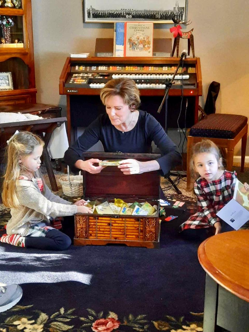 Each year, Maribeth Metz (center) puts on a holiday Christmas pageant with the help of her grandchildren, Alana Metz (left) and Avery Metz (right).