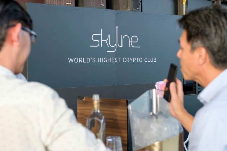 Guests at the Skyline bar in Singapore that bills itself as the world's highest cryptocurrency club