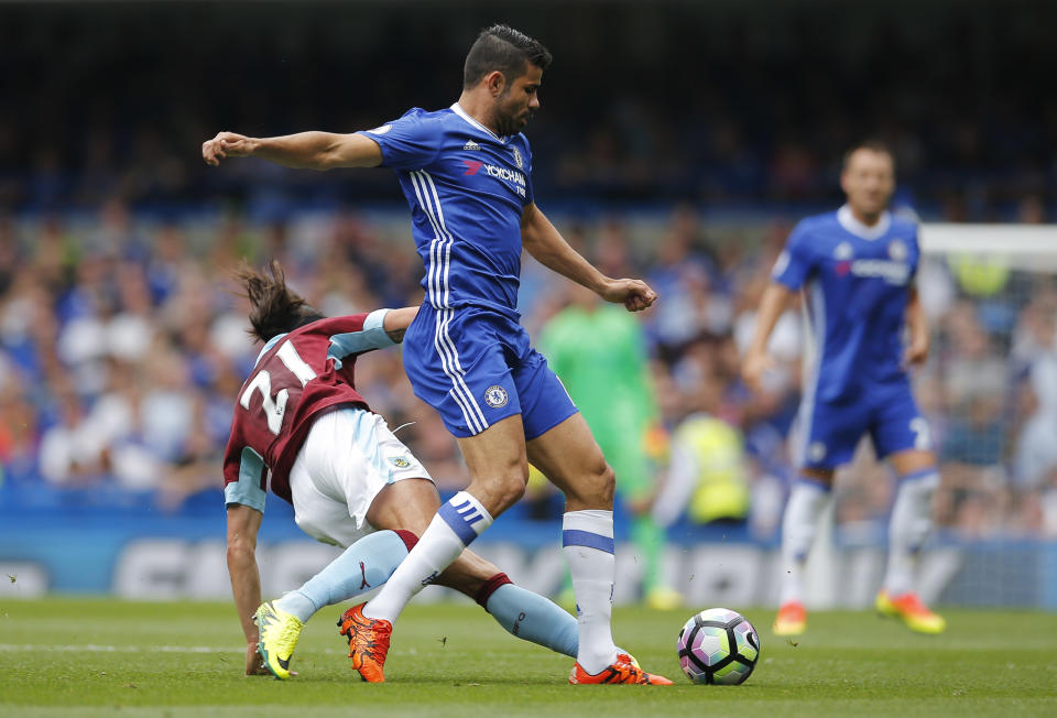 Football Soccer Britain - Chelsea v Burnley - Premier League - Stamford Bridge - 27/8/16 Chelsea's Diego Costa in action with Burnley's George Boyd Action Images via Reuters / Andrew Couldridge Livepic EDITORIAL USE ONLY. No use with unauthorized audio, video, data, fixture lists, club/league logos or "live" services. Online in-match use limited to 45 images, no video emulation. No use in betting, games or single club/league/player publications. Please contact your account representative for further details.