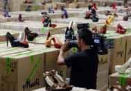 More than 20,000 pairs of counterfeit Louboutin pumps and high heels featuring the distinctive red sole of French designer Christian Louboutin are displayed at Price Transfer Warehouse on August 16, 2012 in Long Beach, California. Between July 27 and Aug. 14, import specialists and officers assigned to the Los Angeles and Long Beach seaport have seized a total of five shipments from China containing more than 20,000 pairs in violation of the French designer's trademark with a potential retail value of $18 million.