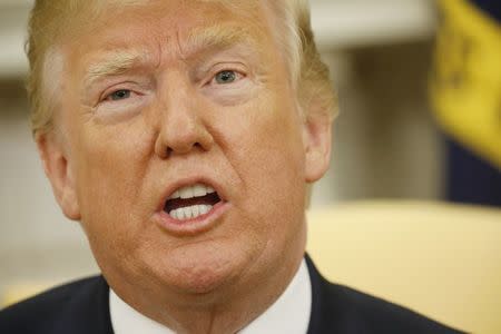 U.S. President Donald Trump speaks during his Oval Office meeting with French President Emmanuel Macron (not pictured) following the official arrival ceremony for Macron at the White House in Washington, U.S., April 24, 2018. REUTERS/Kevin Lamarque