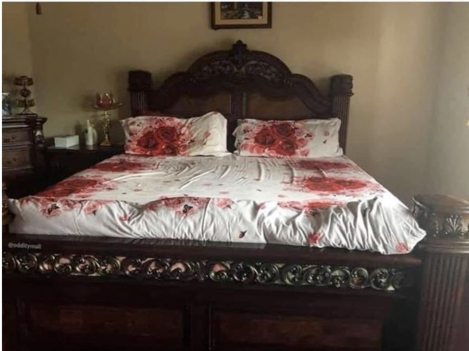 Roses on sheets that look like blood splatter
