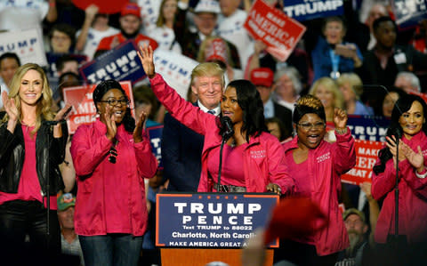 Omarosa Manigault and other Women for Trump members endorse Republican presidential candidate Donald Trump during a campaign rally at the Charlotte Convention Center in Charlotte, N.C., on Friday, Oct. 14, 2016. - Credit: David T. Foster III/Charlotte Observer/TNS via Getty Images