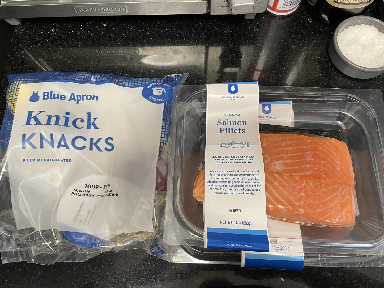 Blue Apron meal kit ingredients in packaging on kitchen counter