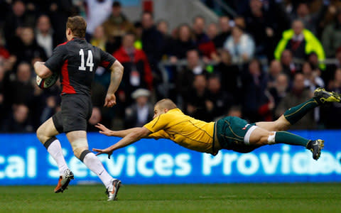 Chris Ashton rounds Drew Mitchell on his way to scoring - Credit: Reuters