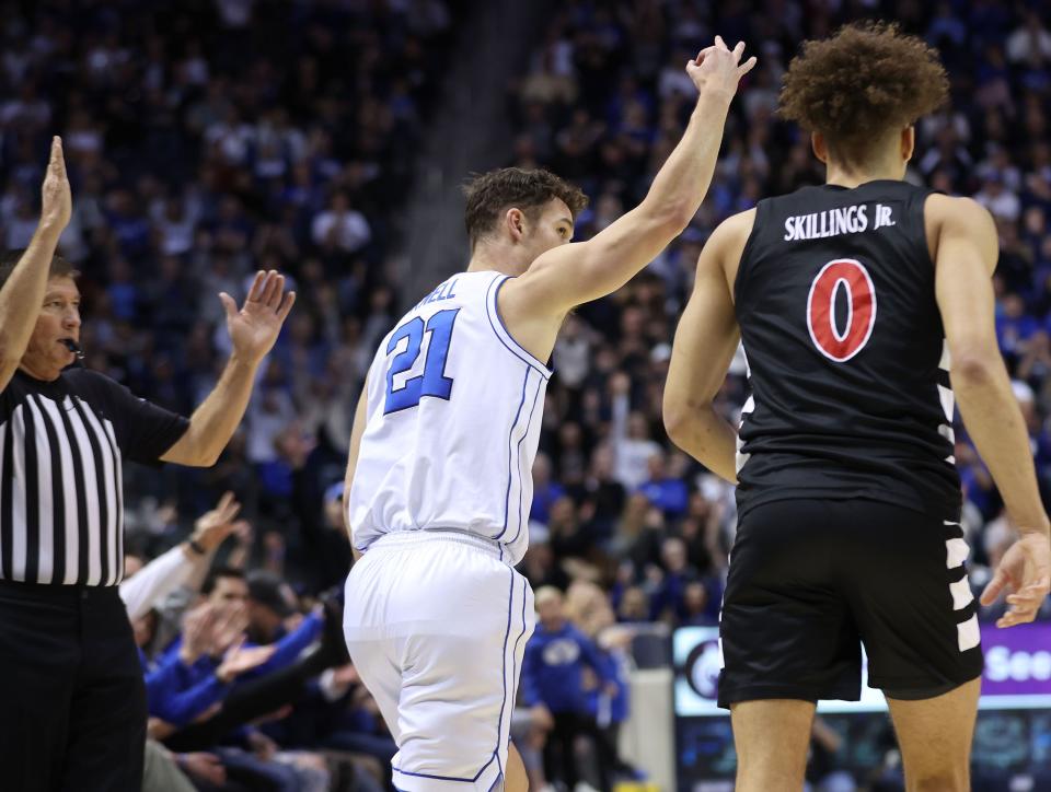 Brigham Young Cougars guard Trevin Knell (21) hits a 3-pointer against the Cincinnati Bearcats in Provo on Saturday, Jan. 6, 2024. Cincinnati won 71-60. | Jeffrey D. Allred, Deseret News