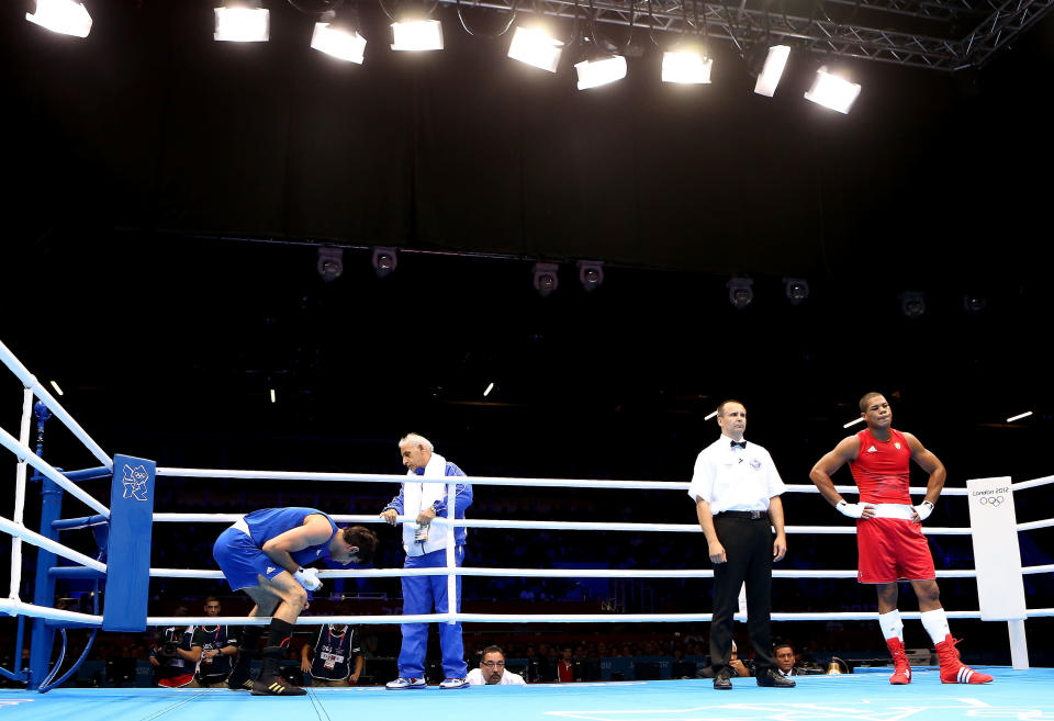 <b>Iran boxer disqualified:</b> Ali Mazaheri cried foul when the heavyweight was disqualified after being warned three times for persistent holding against Cuban Jose Larduet Gomez despite leading by two points going into the second round. "It was a fix. I could have got a bronze easily if it hadn't been for that," an irate Mazaheri, who walked out of the ring before the decision was officially announced, said.<br><br> <a href="http://in.news.yahoo.com/boxing-judges-under-fire-amid-fix-claims-050758137--spt.html " data-ylk="slk:Boxing judges under fire amid "fix" claims;elm:context_link;itc:0;sec:content-canvas;outcm:mb_qualified_link;_E:mb_qualified_link;ct:story;" class="link  yahoo-link">Boxing judges under fire amid "fix" claims</a>