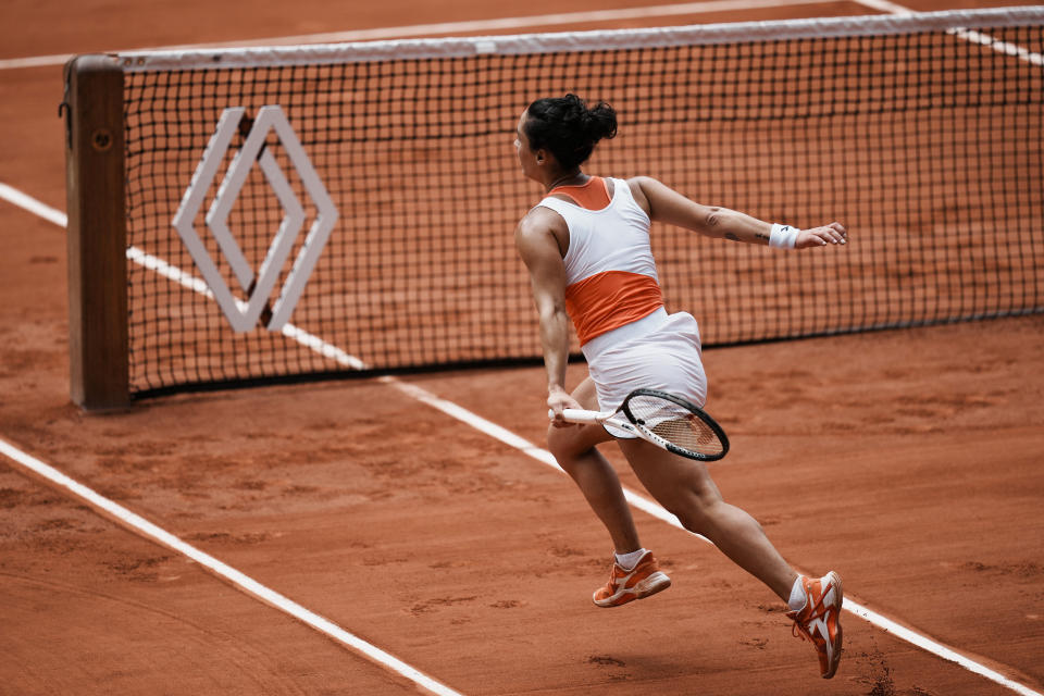 Italy's Martina Trevisan runs to play a shot against Canada's Leylah Fernandez during their quarterfinal match at the French Open tennis tournament in Roland Garros stadium in Paris, France, Tuesday, May 31, 2022. (AP Photo/Thibault Camus)