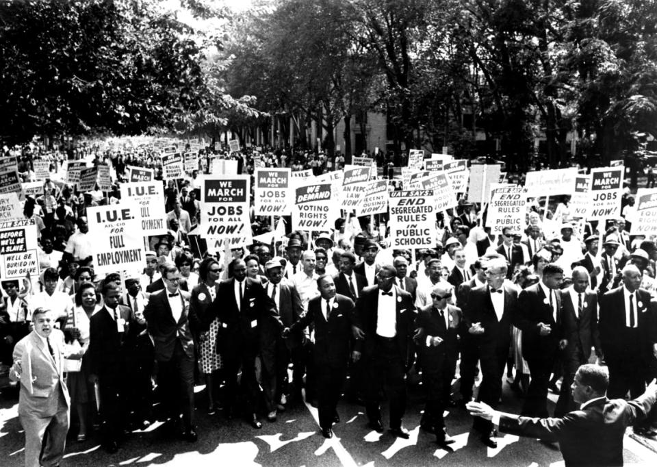 <div class="inline-image__caption"><p>Civil Rights leaders, including Dr. Martin Luther King Jr., holds hands as they march along the National Mall during the March on Washington for Jobs and Freedom, Washington DC, August 28, 1963.</p></div> <div class="inline-image__credit">PhotoQuest/Getty Images</div>