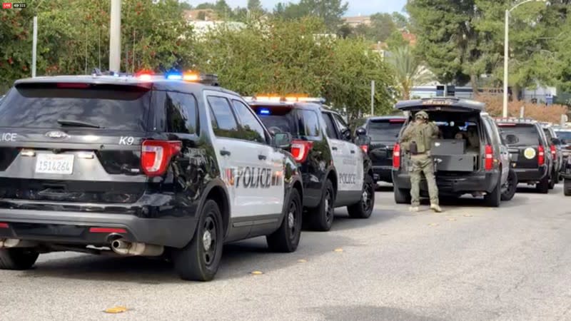 Sheriff puts on tactical gear after a shooting at Saugus High School in Santa Clarita, California