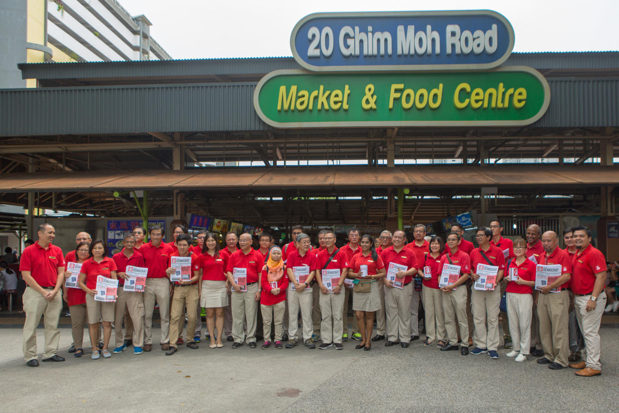 SDP leaders and members take a group photo ahead of the party's walkabout at the Ghim Moh Market and Food Centre on 3 November 2019. (PHOTO: Dhany Osman / Yahoo News Singapore)