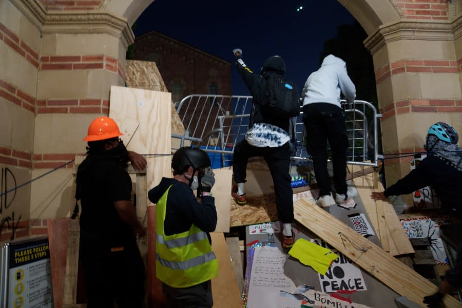 LOS ANGELES, CALIFORNIA – MAY 2: Pro-Palestinian protestors build a makeshift wall in an encampment at the University of California, Los Angeles (UCLA) campus on May 2, 2024 in Los Angeles, California. The camp was declared ‘unlawful’ by the university and many protestors have been detained. Pro-Palestinian encampments have sprung up at college campuses around the country with some protestors calling for schools to divest from Israeli interests amid the ongoing war in Gaza. (Photo by Eric Thayer/Getty Images)