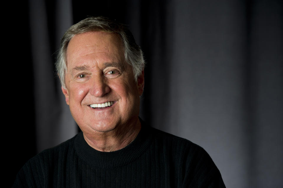 In this April 30, 2012 file photo, singer and children's book author Neil Sedaka poses for a portrait in New York. At 73, the singer-songwriter enlisted the aid of his twin granddaughters as kiddie backup singers on the three-song CD tucked into the children's book "Dinosaur Pet," a book inspired by his 1960 "Calendar Girl." (AP Photo/Charles Sykes)