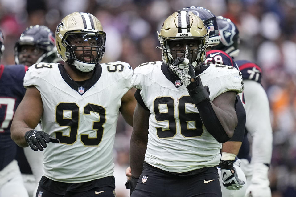 New Orleans Saints defensive end Carl Granderson (96) reacts with defensive tackle Nathan Shepherd (93) after sacking Houston Texans quarterback C.J. Stroud in the second half of an NFL football game in Houston, Sunday, Oct. 15, 2023. (AP Photo/Eric Gay)