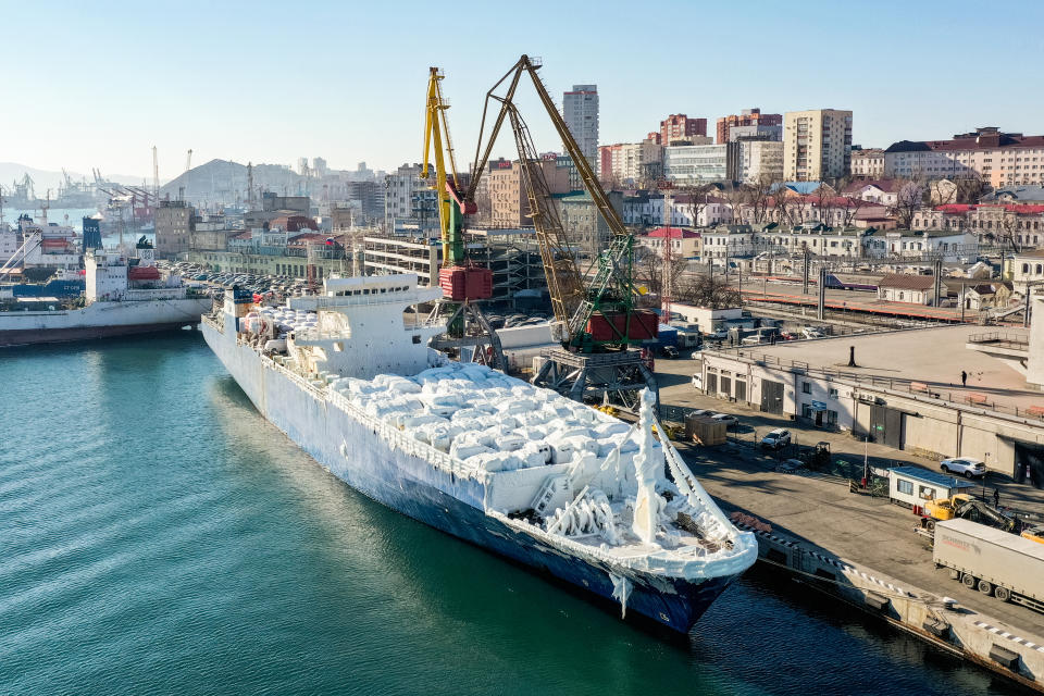 VLADIVOSTOK, RUSSIA  DECEMBER 28, 2021: An aerial view of an ice-covered Sun Rio cargo ship carrying second hand cars from Japan in the port of Vladivostok. Ship icing occurs due to a humid sea wind, waves and sub-zero air temperatures which leads to an increase in draft, heeling and can increase the risk of a ship's overturn. Yuri Smityuk/TASS (Photo by Yuri Smityuk\TASS via Getty Images)