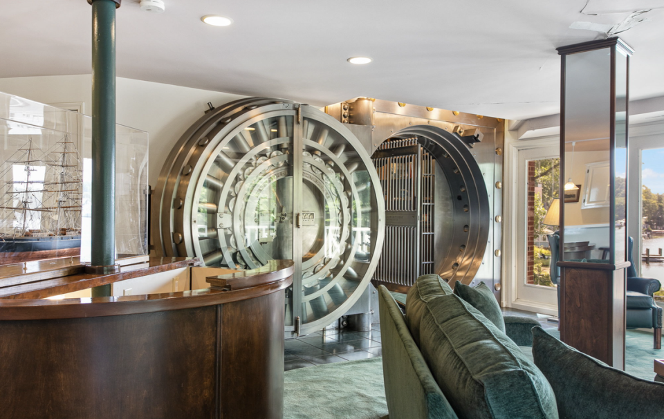 A tunnel leads to this room with a large vault.