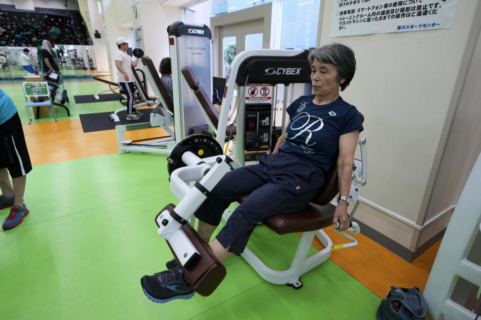 Yasuko Kuroi, 72, uses a leg extension machine as she works out at the Fukagawa Sports Center in Tokyo, Wednesday, June 12, 2024. If you are getting up there in years, weight-resistance training might deliver unexpected benefits. (AP Photo/Hiro Komae)