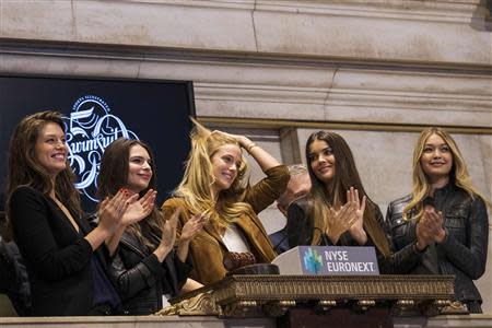 2014 Sports Illustrated Swimsuit Models Emily DiDonato, Natasha Barnard, Kate Bock, Emily Ratajkowski and Gigi Hadid (L-R) ring the closing bell at the New York Stock Exchange February 13, 2014. REUTERS/Brendan McDermid