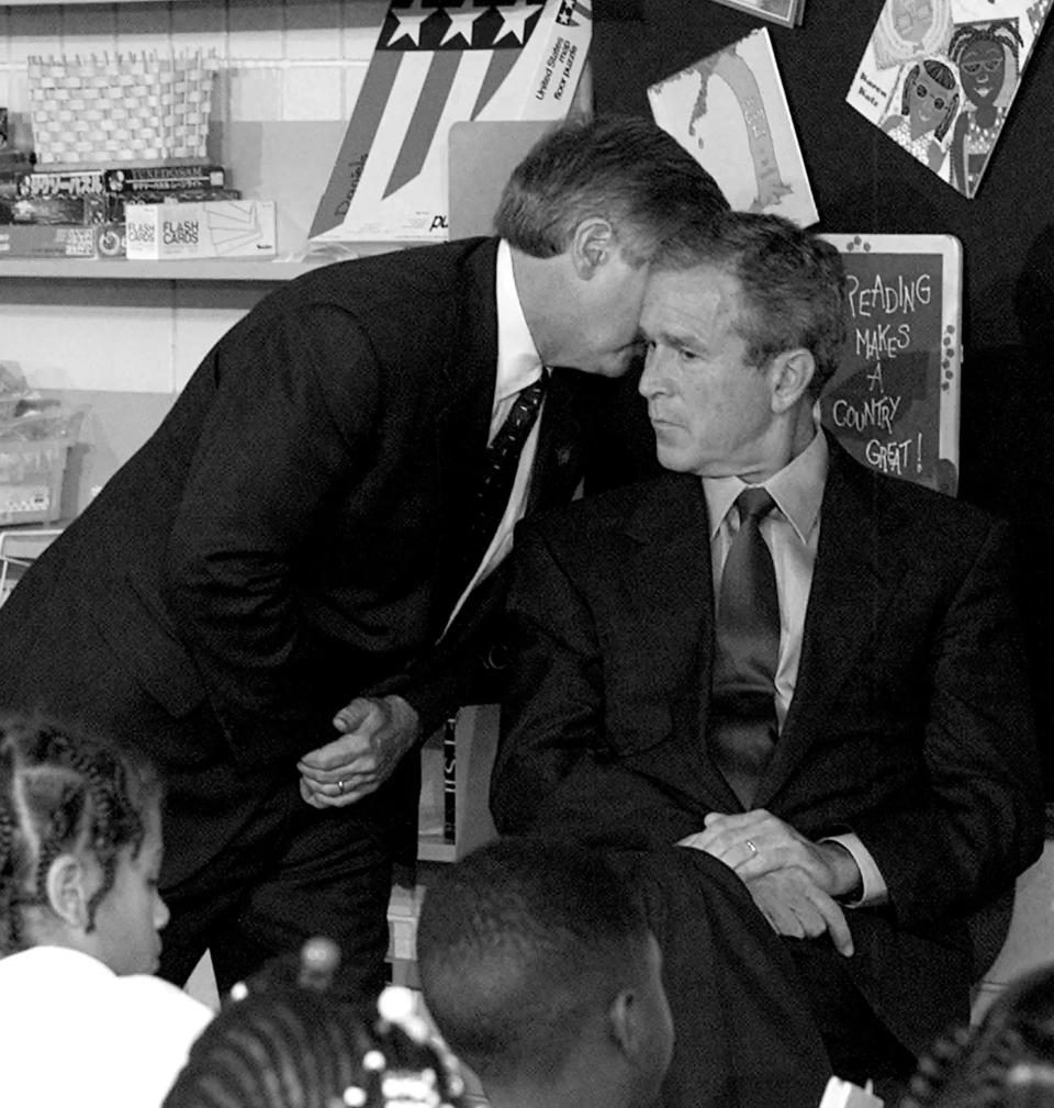 On Sept. 11, 2001, Chief of Staff Andrew Card tells President George W. Bush that a second plane has crashed into the World Trade Center. Bush was visiting Booker Elementary, in Sarasota, to read "The Pet Goat."