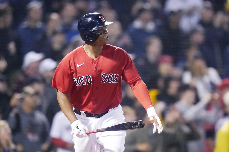 Boston Red Sox's Rafael Devers watches the flight of his winning RBI-single in the bottom of the ninth inning of a baseball game against the Toronto Blue Jays at Fenway Park, Monday, June 14, 2021, in Boston. (AP Photo/Charles Krupa)