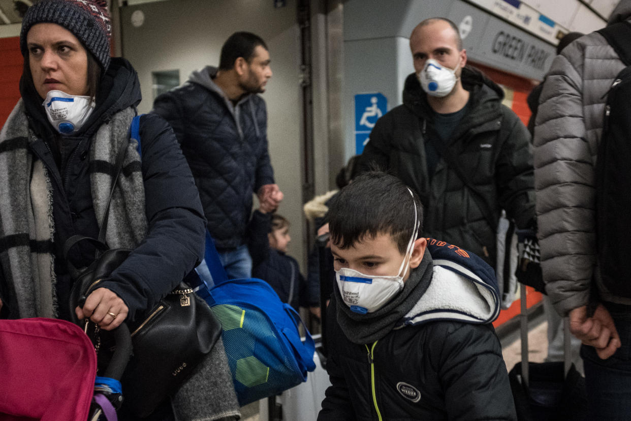 People are seen on a tube wearing face masks. A total of nine people in the UK are now being treated for COVID-19, the disease caused by the coronavirus. Doctors have warned that the London Underground could be a hotbed for the coronavirus. (Photo by S.C. Leung / SOPA Images/Sipa USA)